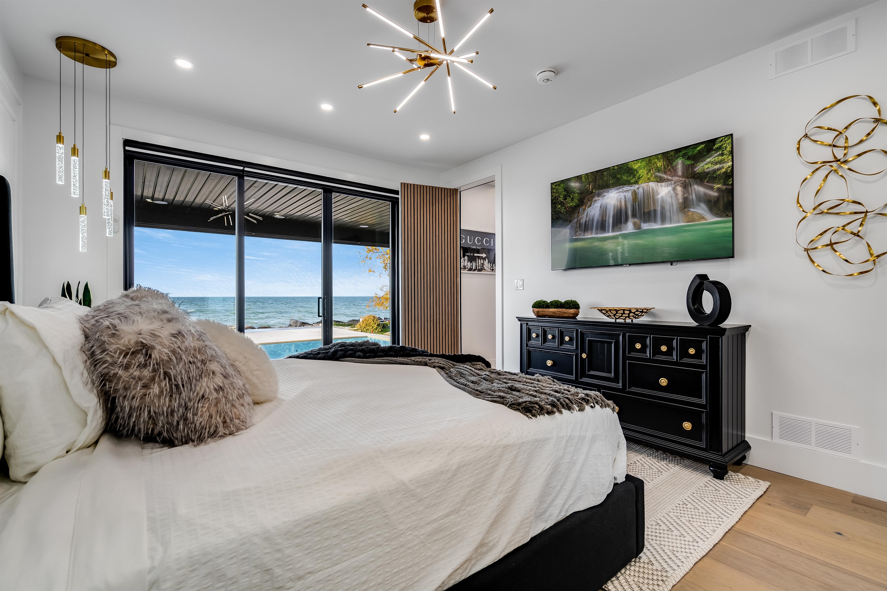 Premier Master Suite on the main floor with patio access and lake views.
