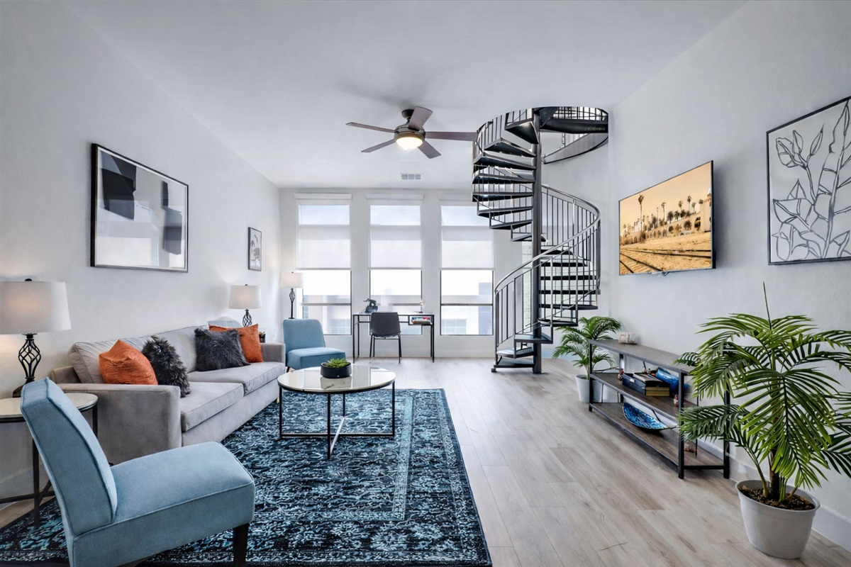 Bright and comfortable living room designed for relaxation, featuring cozy seating, stylish décor, and a welcoming space to unwind, watch TV, or spend time with family and friends.