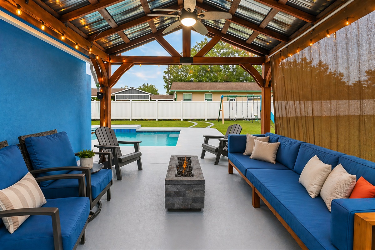 backyard with firepit and covered Lanai
