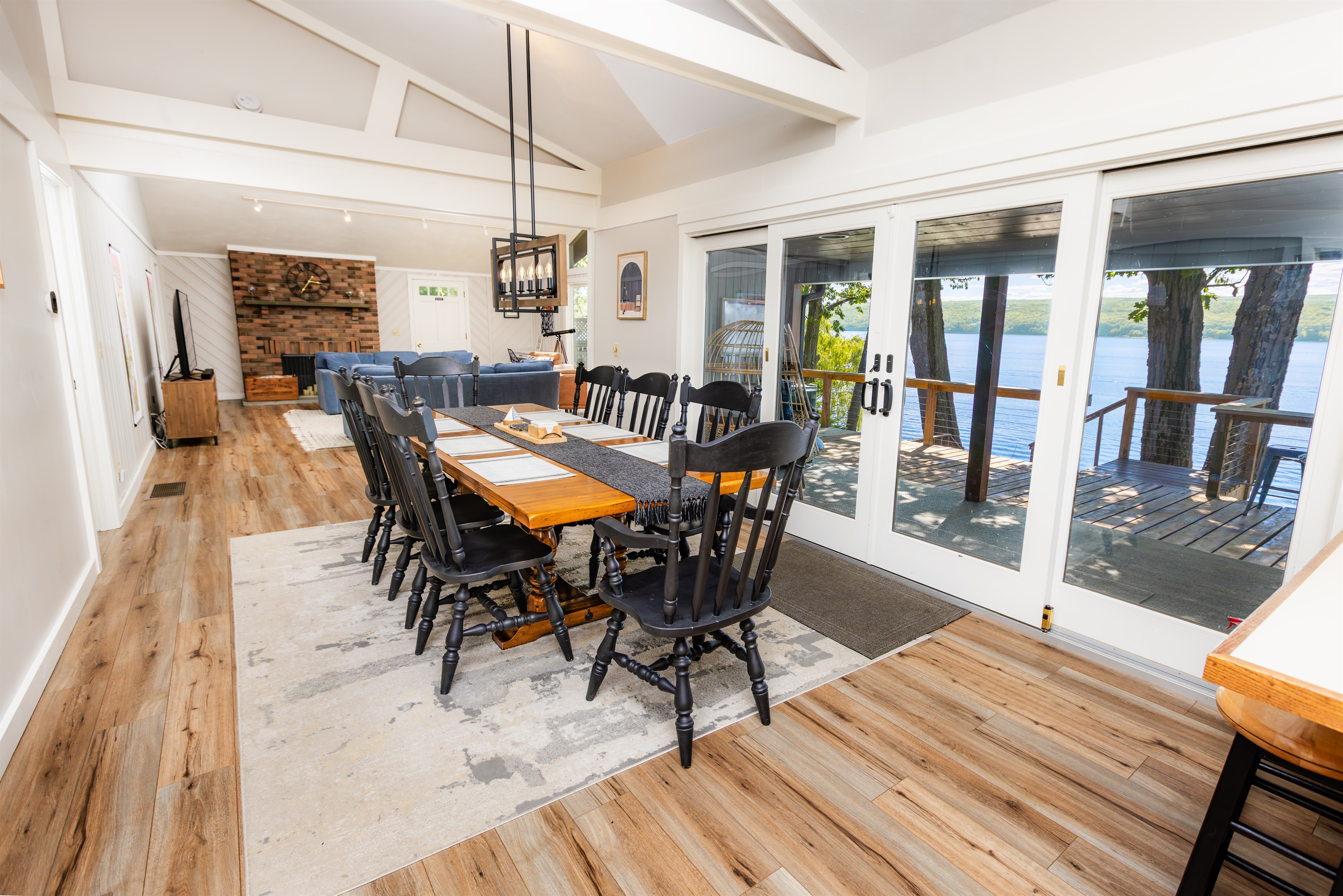 Dining Area | Table with Seating for 8 |  Additional Seating at the Breakfast Bar | Sliding Glass Doors to Covered Deck Area