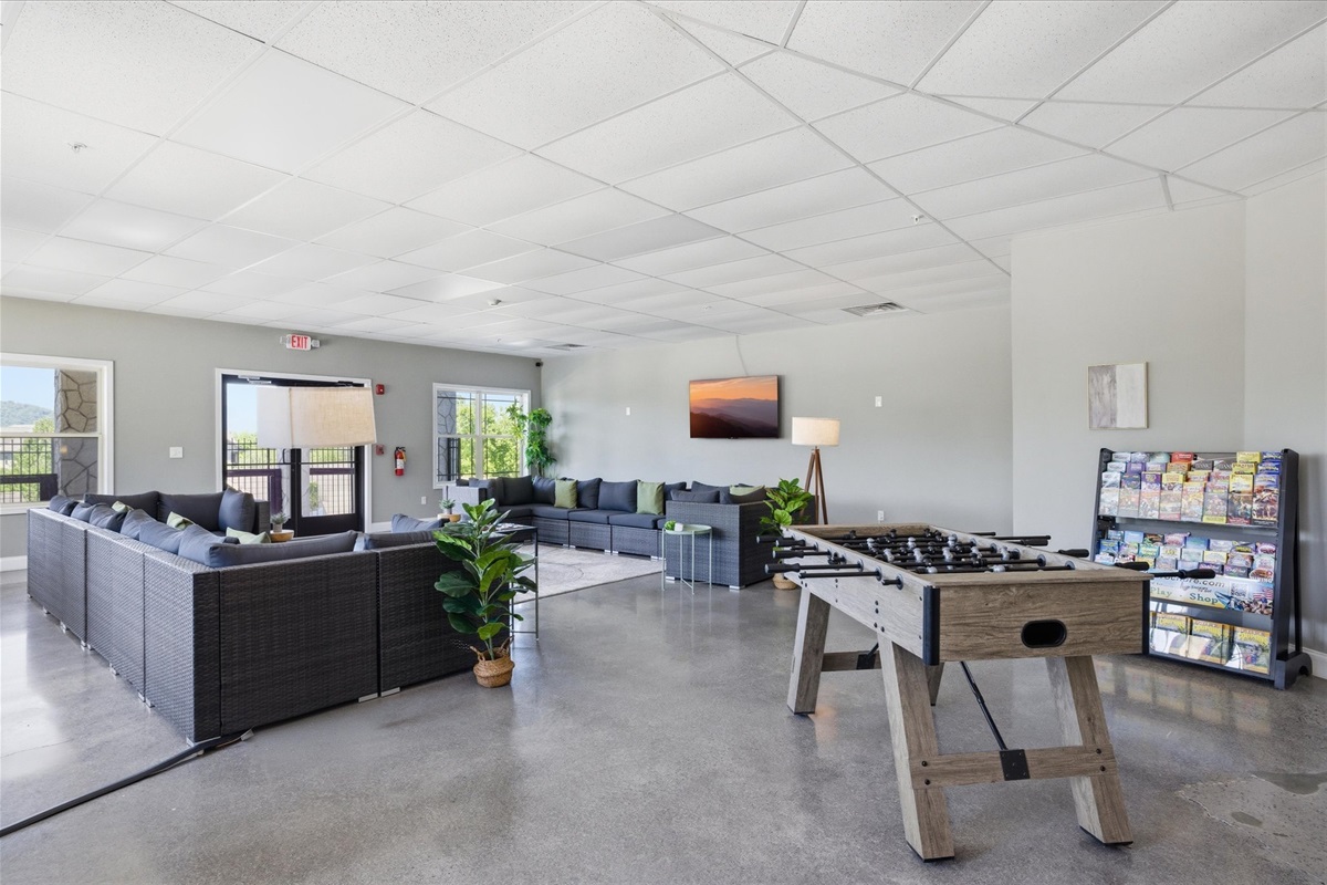 This inviting lounge space in the community clubhouse is ideal for gathering with your group, watching a game, or jumping into a friendly foosball match. Comfortable seating and an open layout make it easy to spend time together.