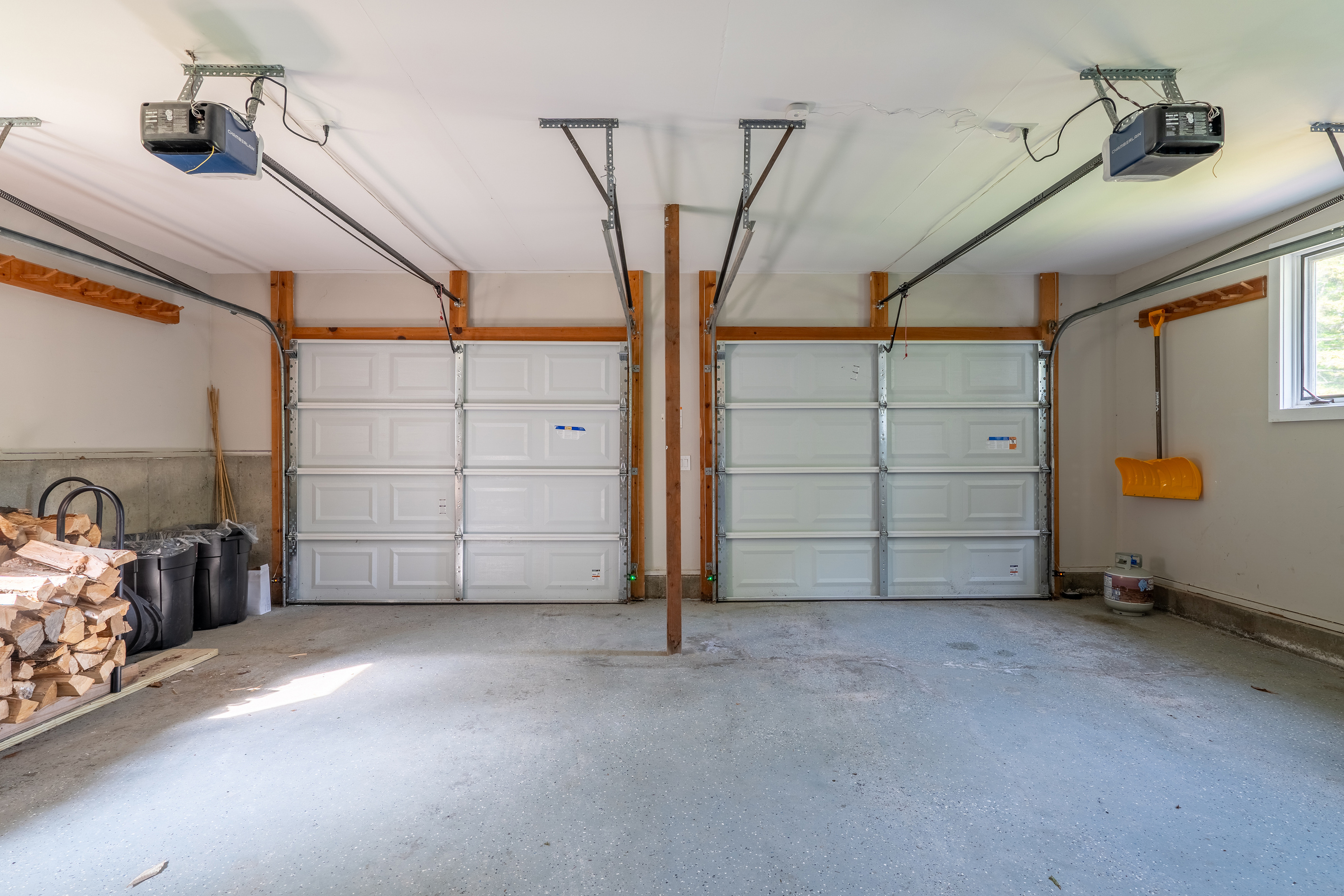 Garage interior with firewood storage and space for skis, bikes and outdoor gear