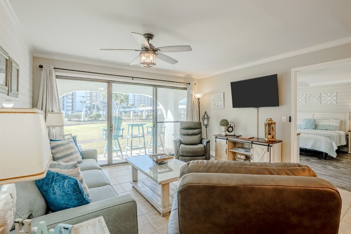 Updated gorgeous ground floor unit looking over the 9th hole and just steps to the bridge to the beach