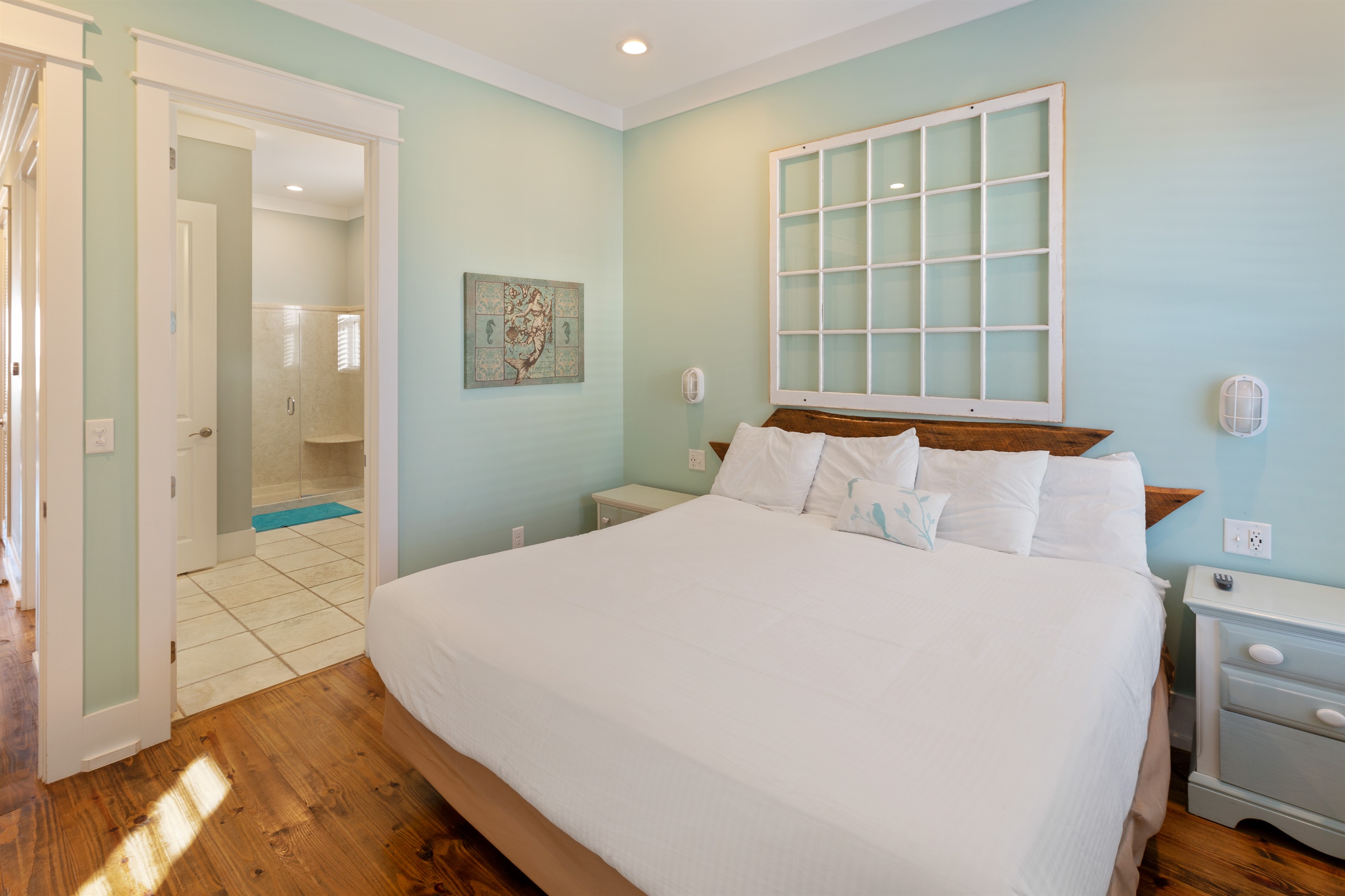 The Mermaid room is a king suite with attached, shared bath on the second floor overlooking the pool and yard area.