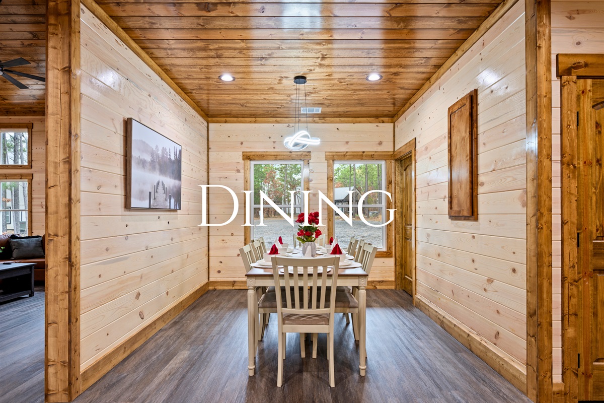 Just off the kitchen, the dining table is set for shared meals, game nights, and long conversations with family and friends.