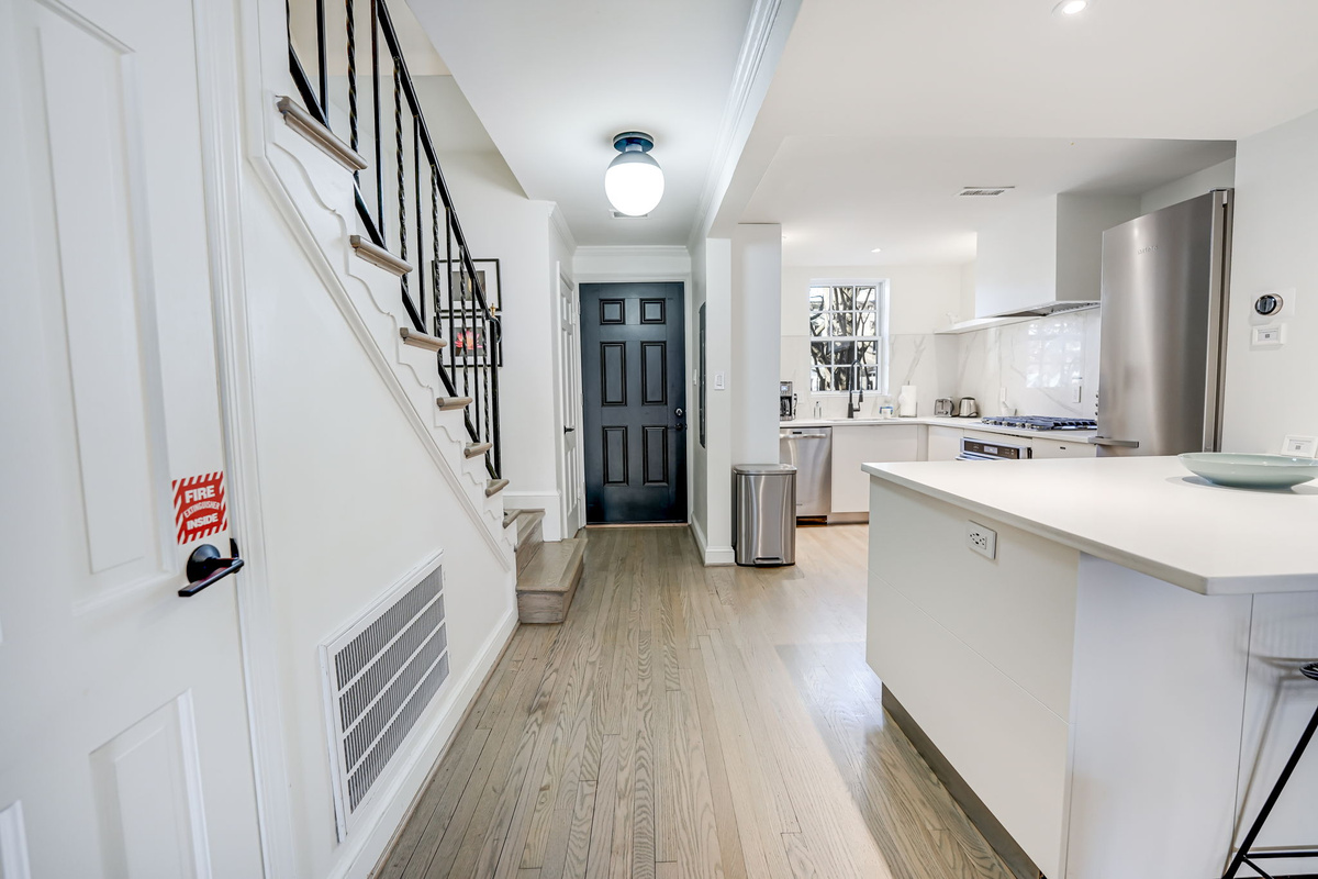 Front Entrance: Half Bath, Open Concept Kitchen & Island.