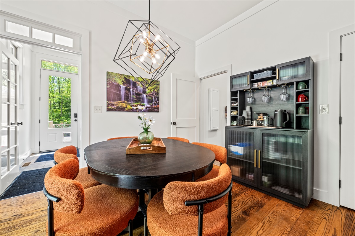 Start your mornings in style at this cozy breakfast nook, complete with a curated coffee and tea bar, modern lighting, local artwork, and vibrant seating. The perfect spot for casual bites or slow sips.