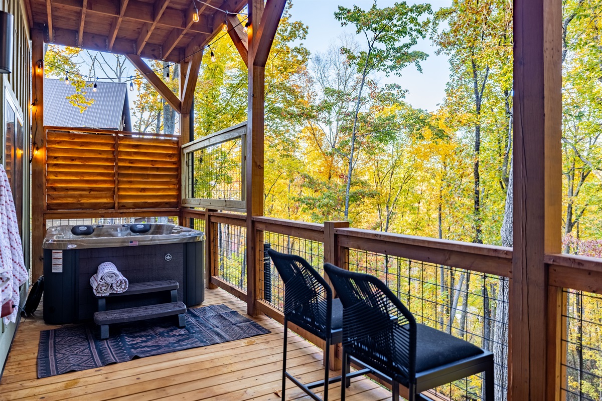 Covered hot tub retreat on the lower deck