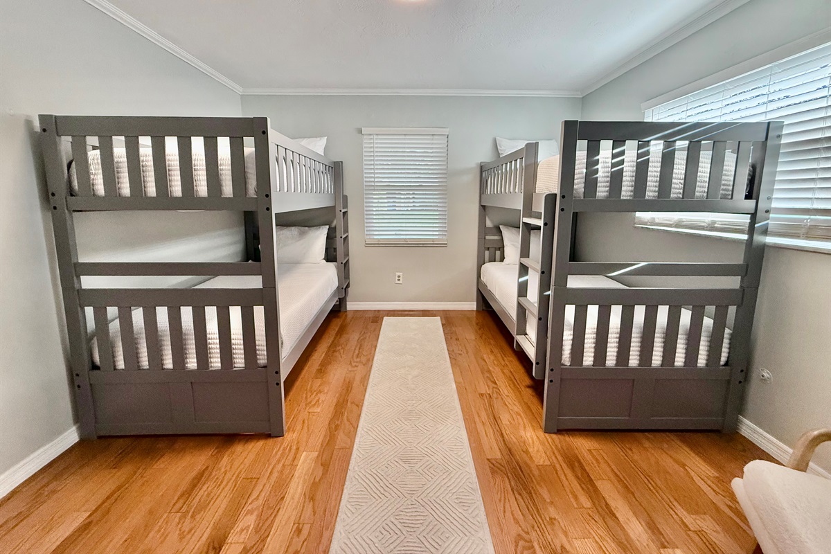 Perfect for the kids or a group of friends, this bright bunk room sleeps four comfortably with two twin-over-twin bunk beds.