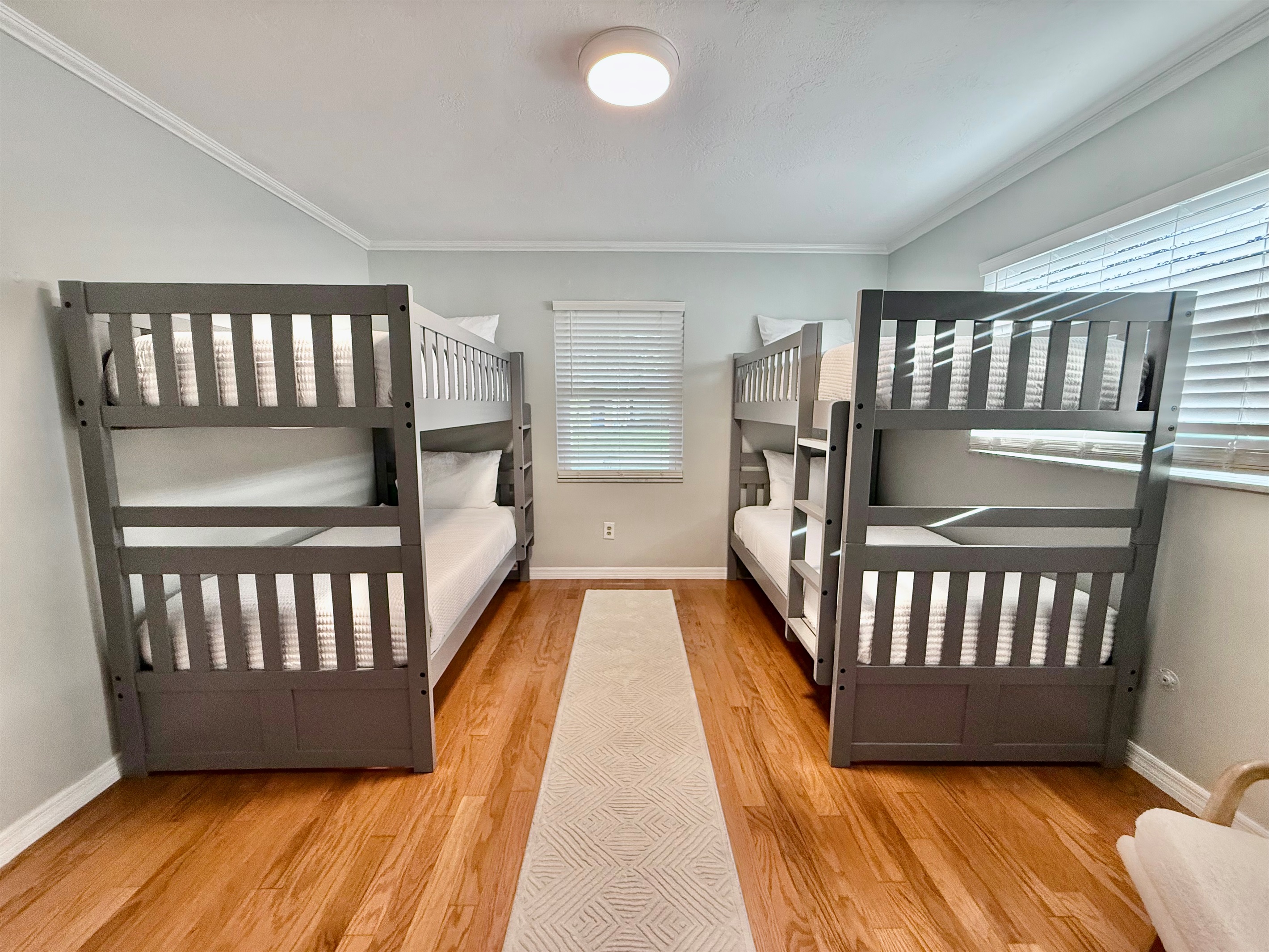 Perfect for the kids or a group of friends, this bright bunk room sleeps four comfortably with two twin-over-twin bunk beds.