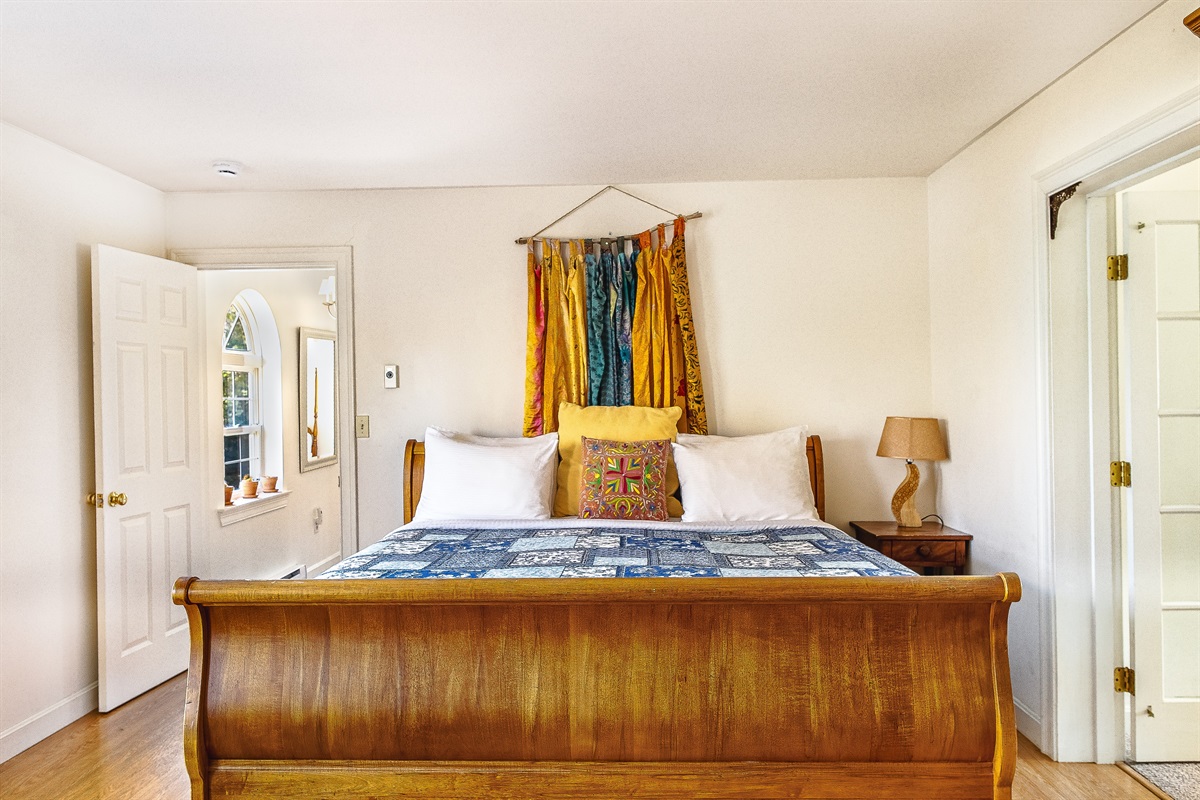 Rest easy in the primary King sleigh bed, a centerpiece of comfort at Seven Peaks Ridge. Thoughtfully decorated with vibrant textiles, this airy room is the perfect sanctuary to recharge after exploring the wonders of Mount Desert Island.