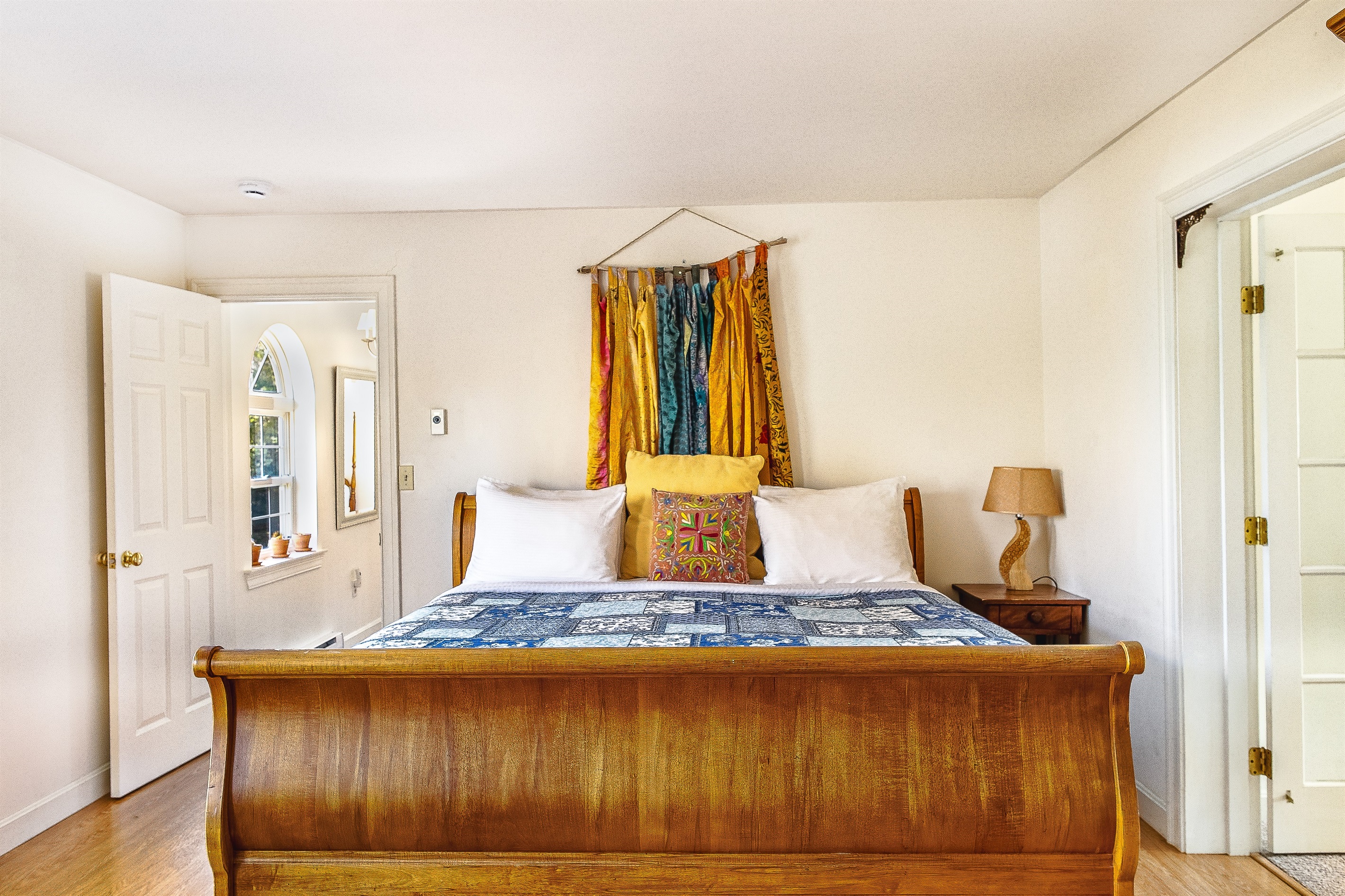 Rest easy in the primary King sleigh bed, a centerpiece of comfort at Seven Peaks Ridge. Thoughtfully decorated with vibrant textiles, this airy room is the perfect sanctuary to recharge after exploring the wonders of Mount Desert Island.