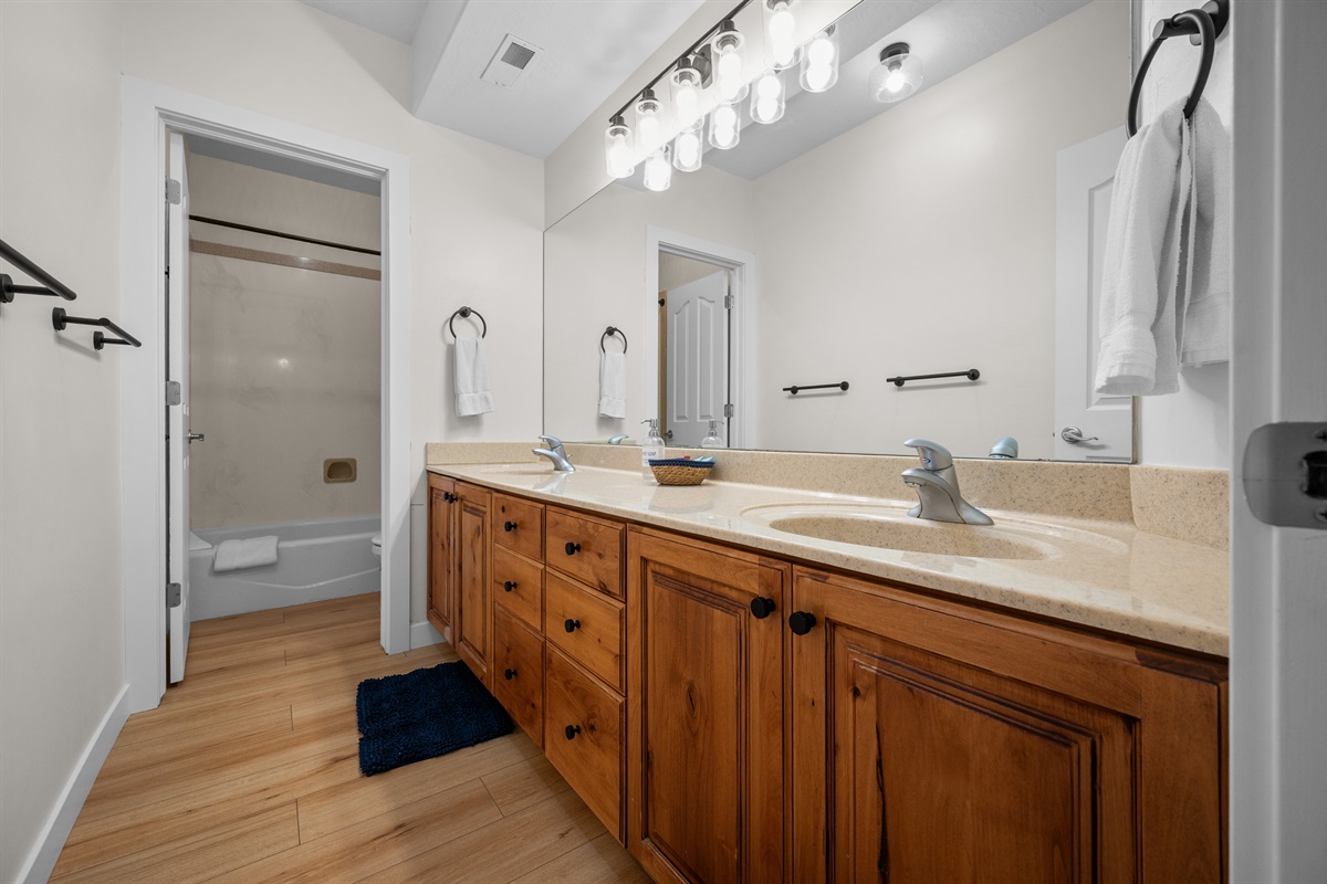Large bathroom with dual vanity and plenty of counter space.