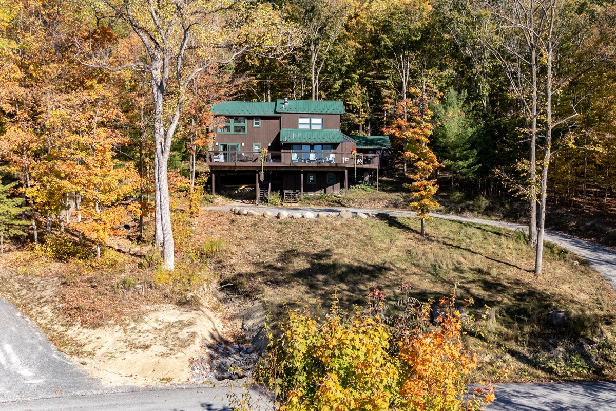 Golden leaves frame this cozy lakeside spot, complete with a private dock for swimming or kayaking.