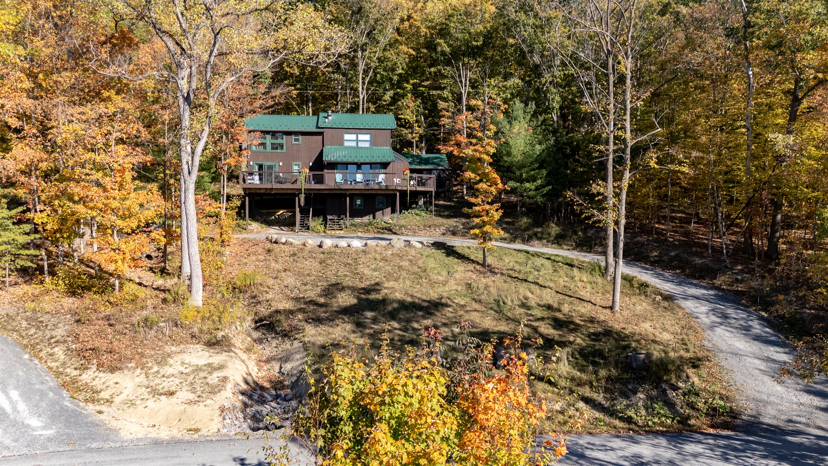 Golden leaves frame this cozy lakeside spot, complete with a private dock for swimming or kayaking.
