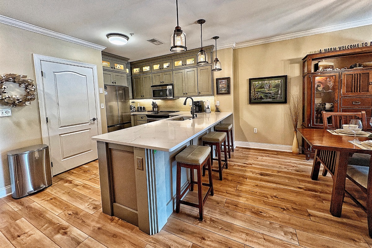 New cabinets, quartz countertops,refrigerator and luxury vinyl plank added to the kitchen