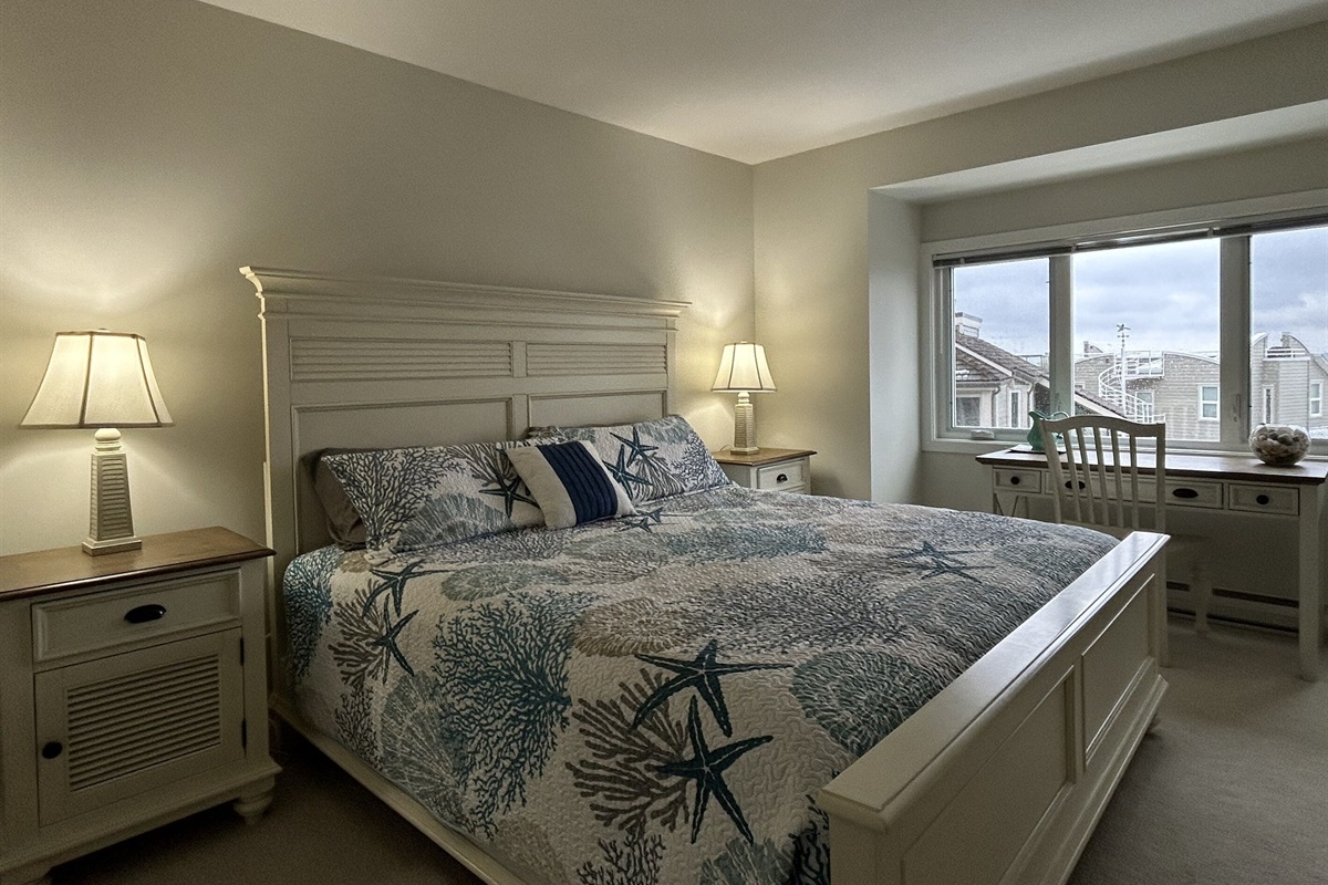 Primary king bedroom with private deck