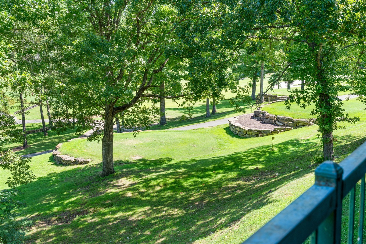 Peaceful golf-course and treetop views from the private deck give the condo its quiet, tucked-away feel.