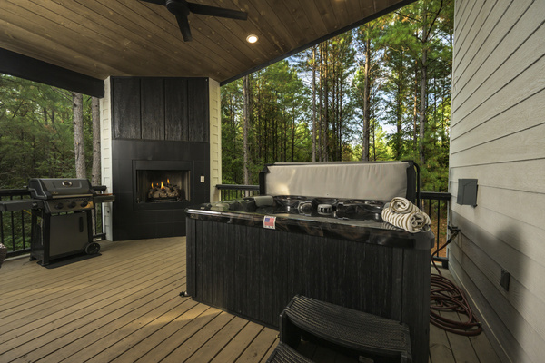 Your perfect evening: a fire, a relaxing hot tub soak, and peaceful forest surroundings.