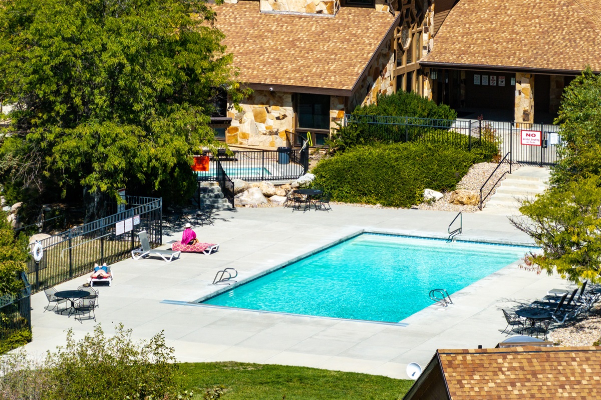 Seasonal outdoor pool and lounging area for sunny days.