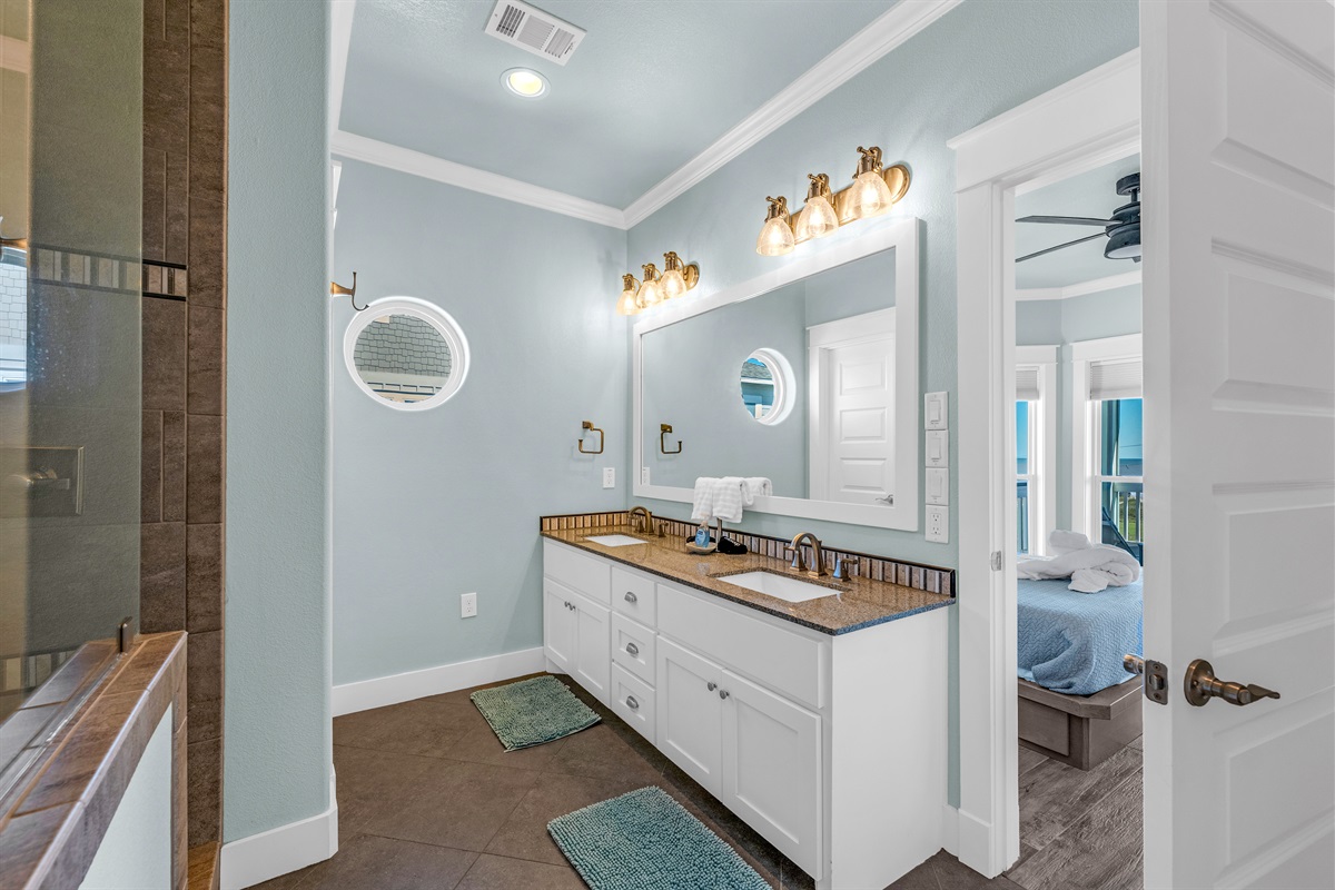 Crystal Paradise Bathroom 4: Spacious Jack-and-Jill bathroom connecting Bedrooms 4 and 5, well-lit with a large vanity mirror.