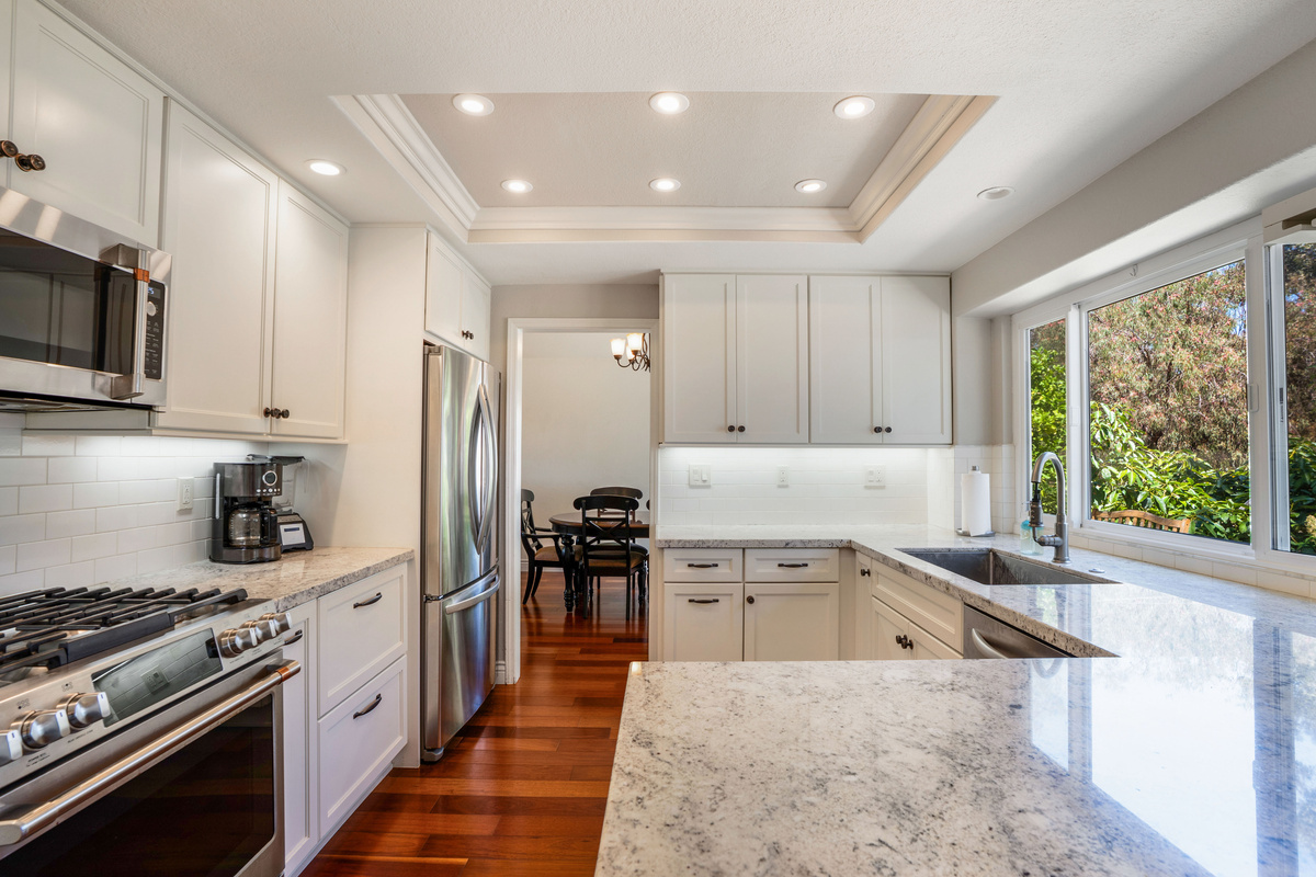 Well-Appointed Kitchen with Granite Countertops, Custom Cabinetry, Wine Fridge & Dishwasher