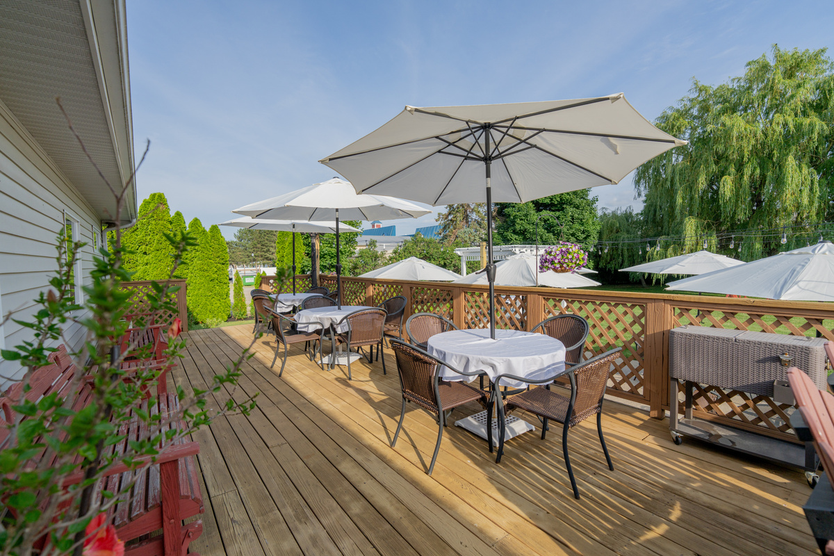 Enjoy breakfast outdoors on the deck overlooking lush gardens, flowering landscapes, and the tranquil beauty of our historic Victorian Inn property