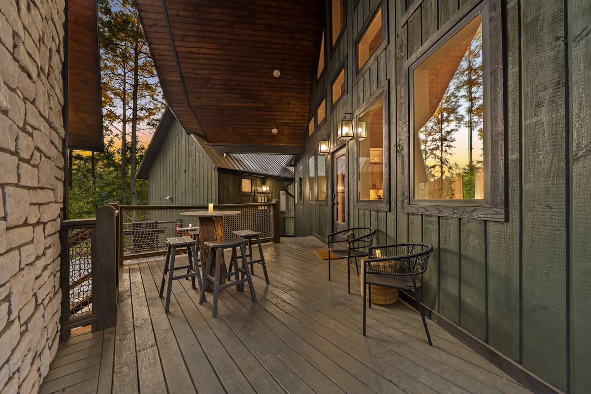 Elevated decks and walkways connect the separate pods, creating the feeling of moving through your own private treehouse village.