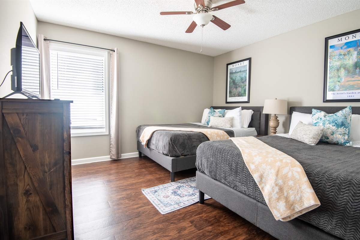 The second double queen room in Unit B boasts an ensuite bathroom and another smart TV for movie marathon nights!