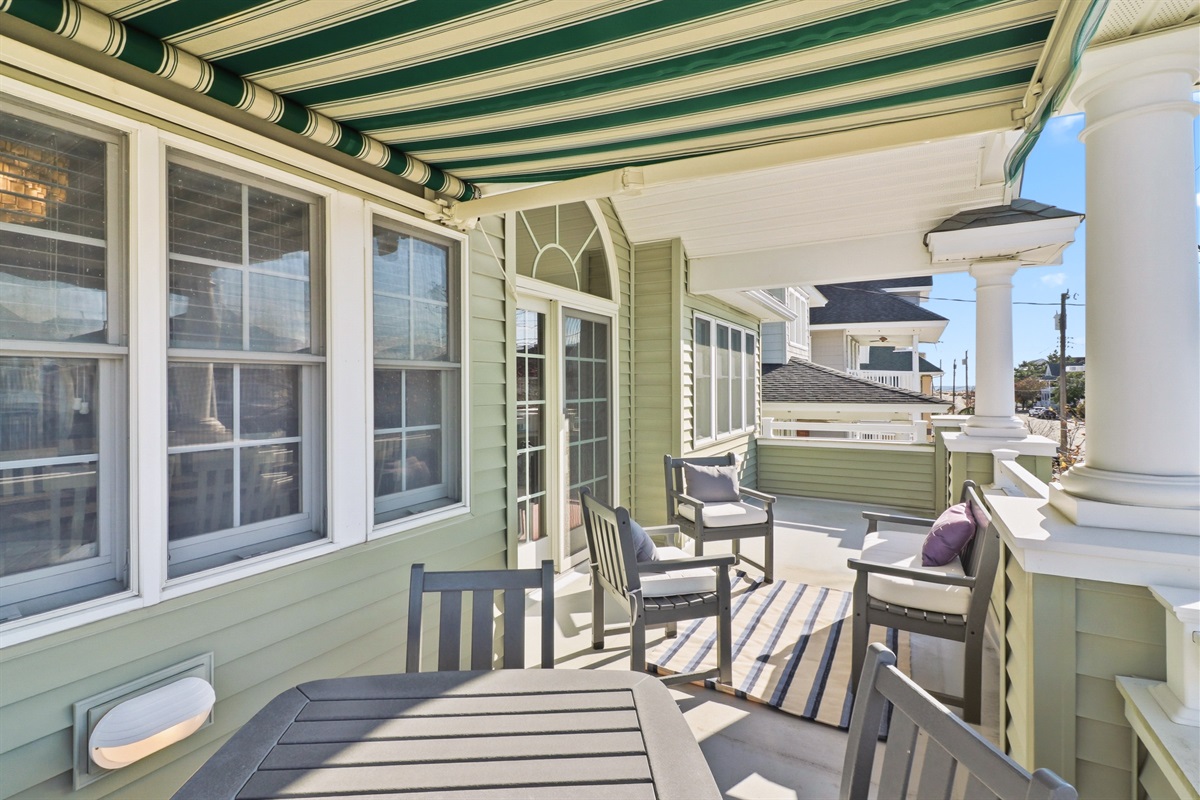 Relax and unwind on a balcony with multiple seating