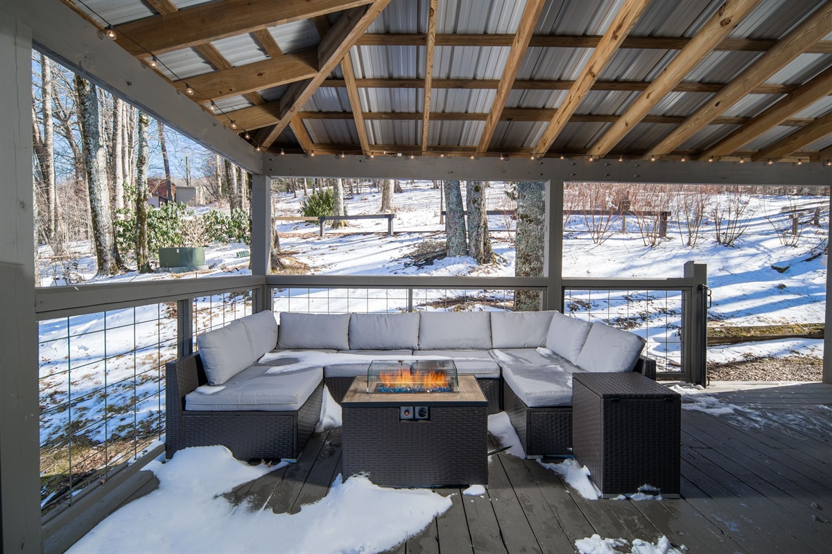 Unit 6: Back deck with a large sectional & propane fire pit