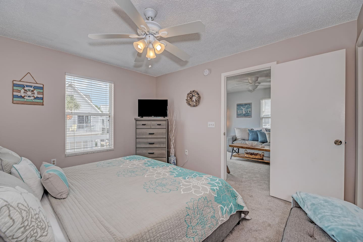 Primary bedroom with attached full bath and walk in closet. Enjoy a restful night on our king bed with lux mattress (a Purple mattress!). 