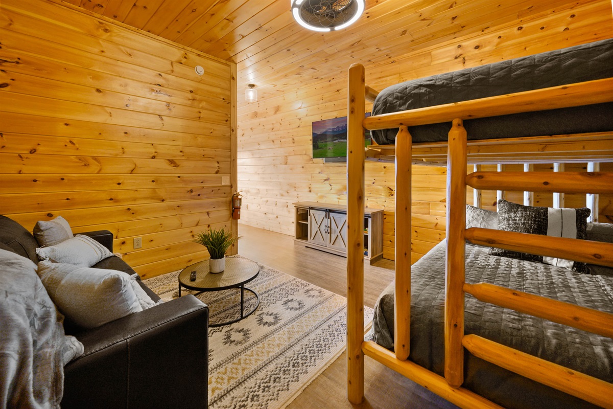 Cozy Bunk room with pull out couch - Please note the bunk room has a half wall separating it from pool table room, no doors.