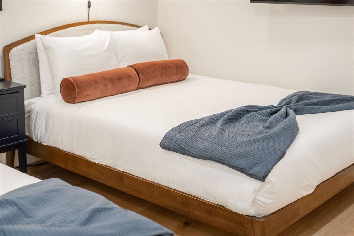 Each bed is designed with a plush headboard for added comfort during your stay.