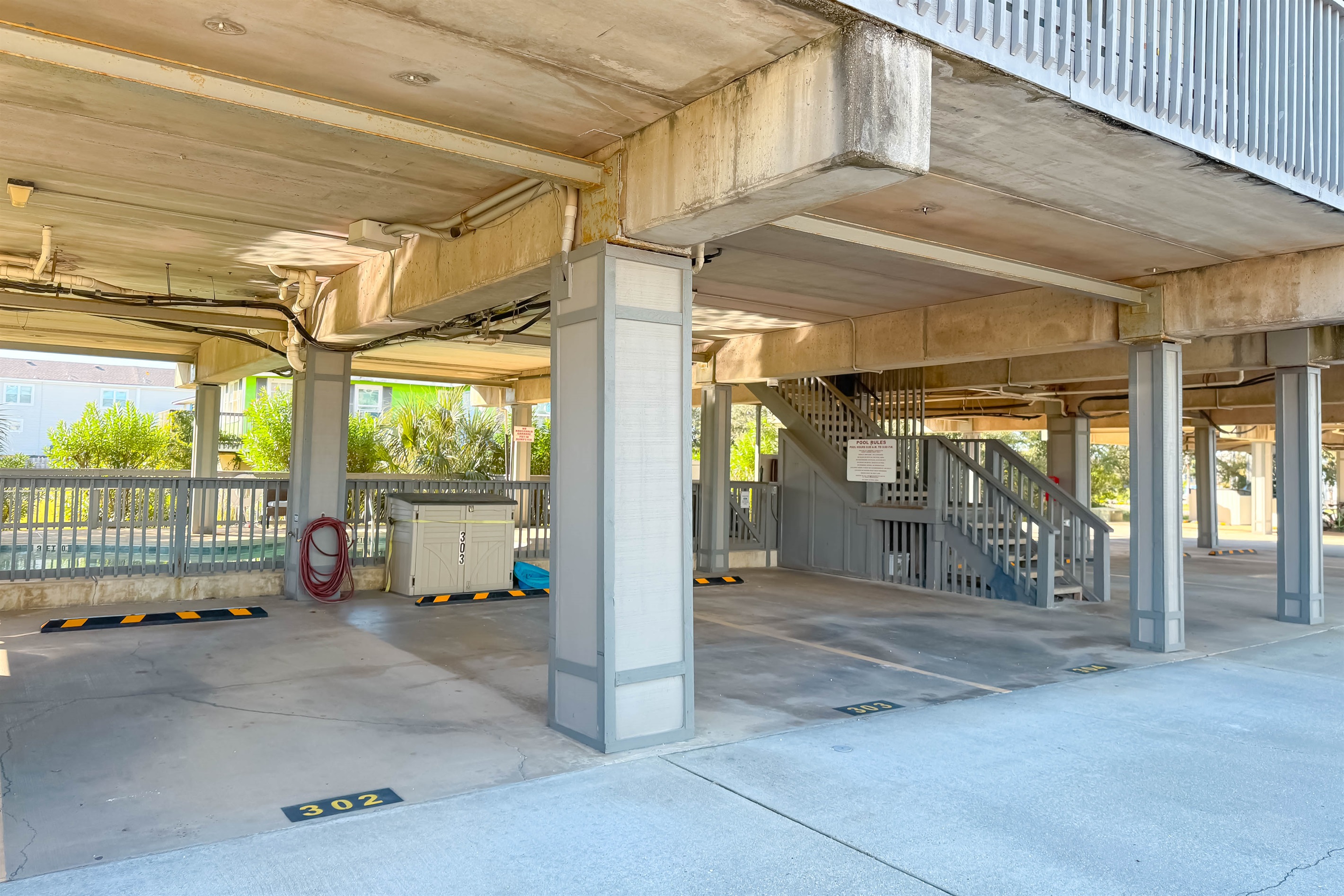 302 is the condo's parking space.  Additional guest parking also available.