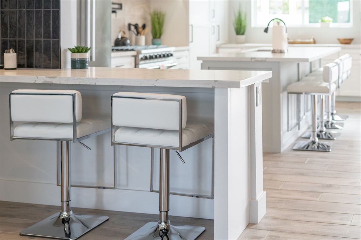 Enjoy the spacious kitchen overlooking a stylish island, perfect for meal prep and casual dining.