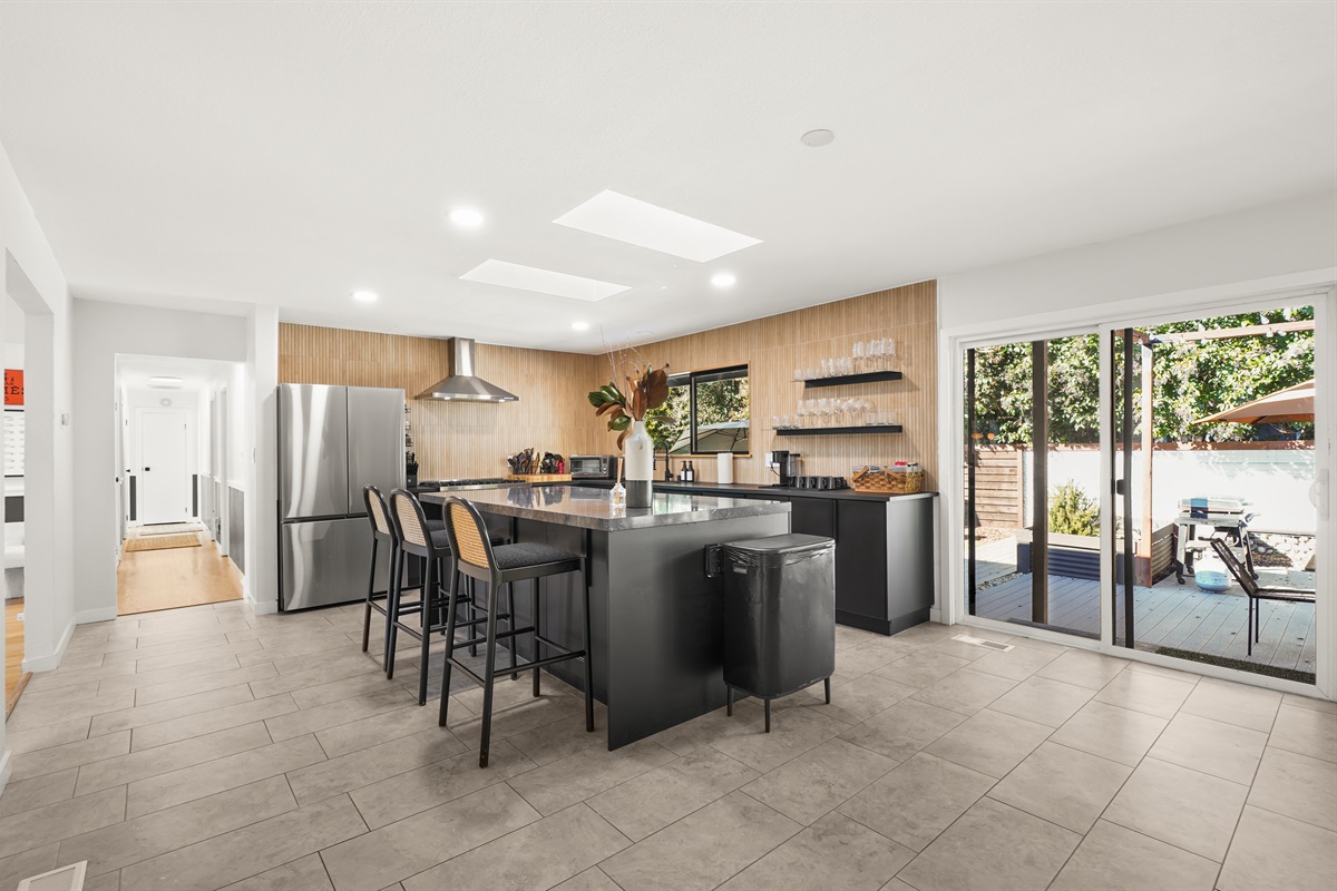 Fully equipped and thoughtfully designed, the kitchen features modern appliances, generous counter space, and everything needed to prepare meals during your stay.