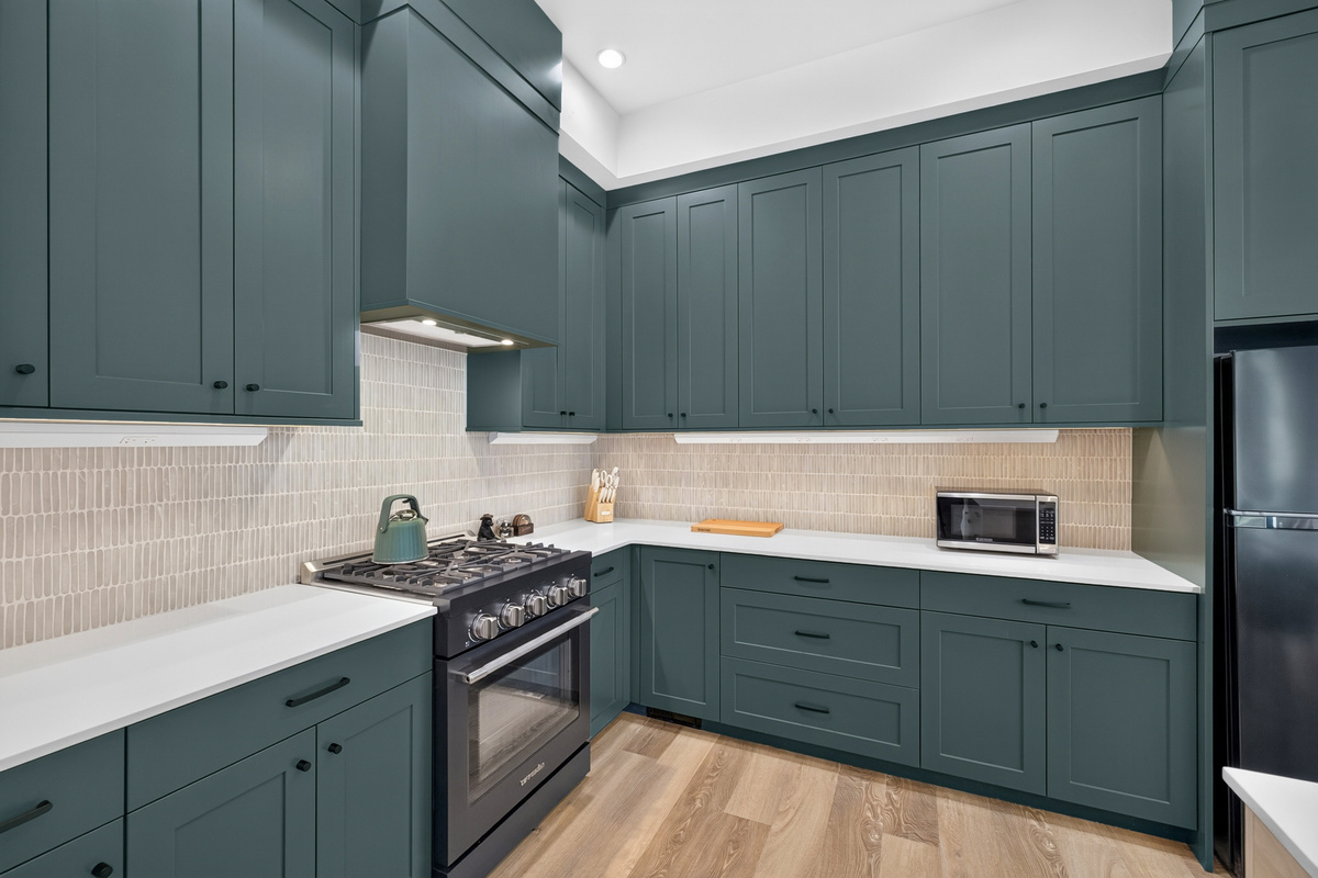 Cook almost any meal you want in this modern and fully stocked downstairs kitchen (1st of 2 kitchens!).  
