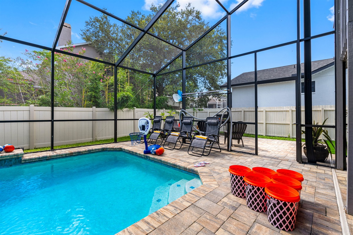 Float the day away on a whimsical unicorn, splash under the soothing waterfall, or shoot hoops poolside—this backyard oasis is made for memories.