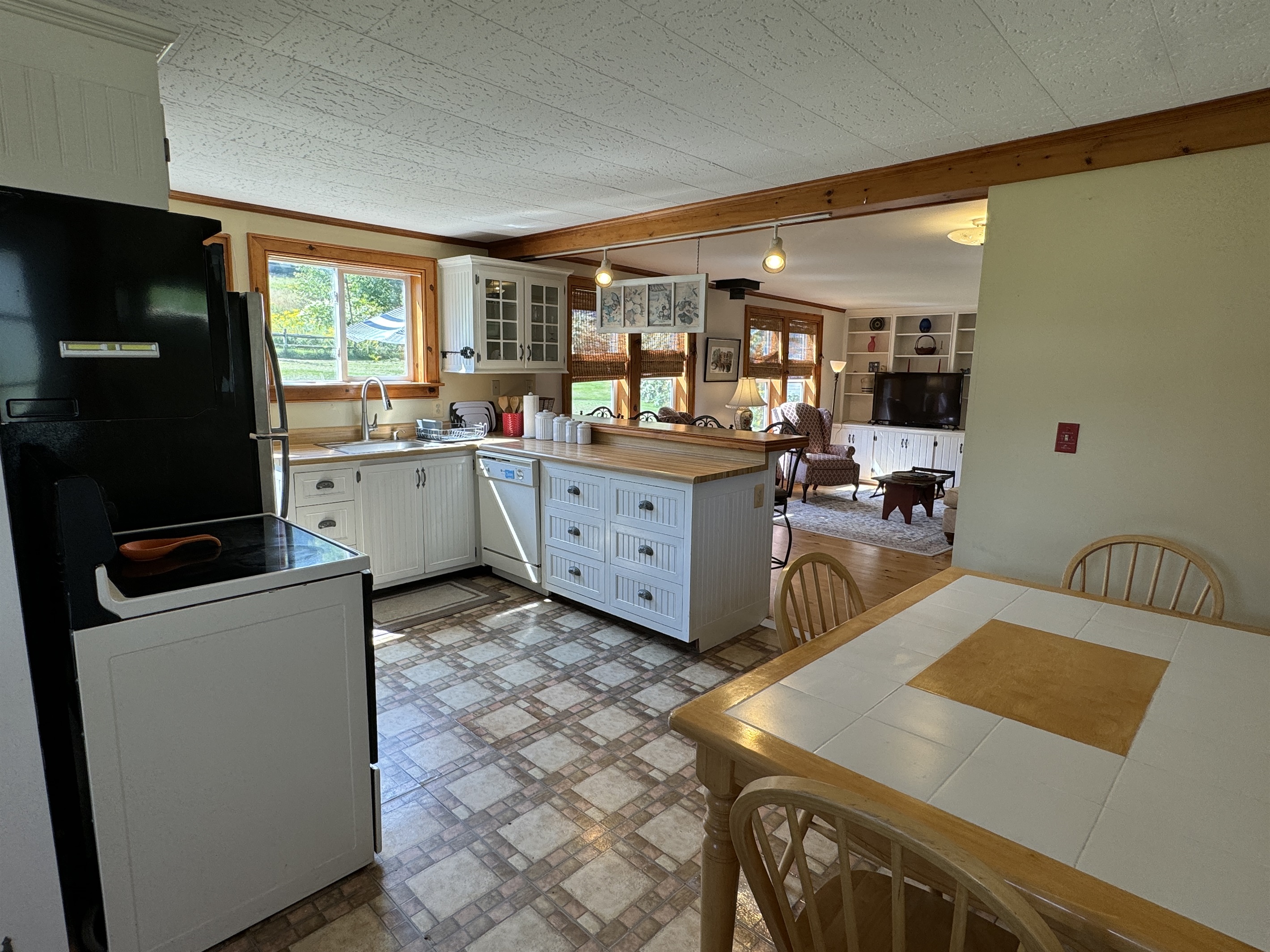 Eat-in kitchen with living room beyond