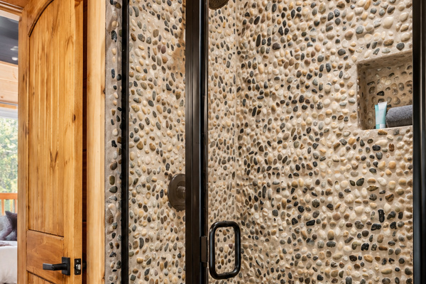 Lather up surrounded by creek stones, like showering beside a mountain stream.