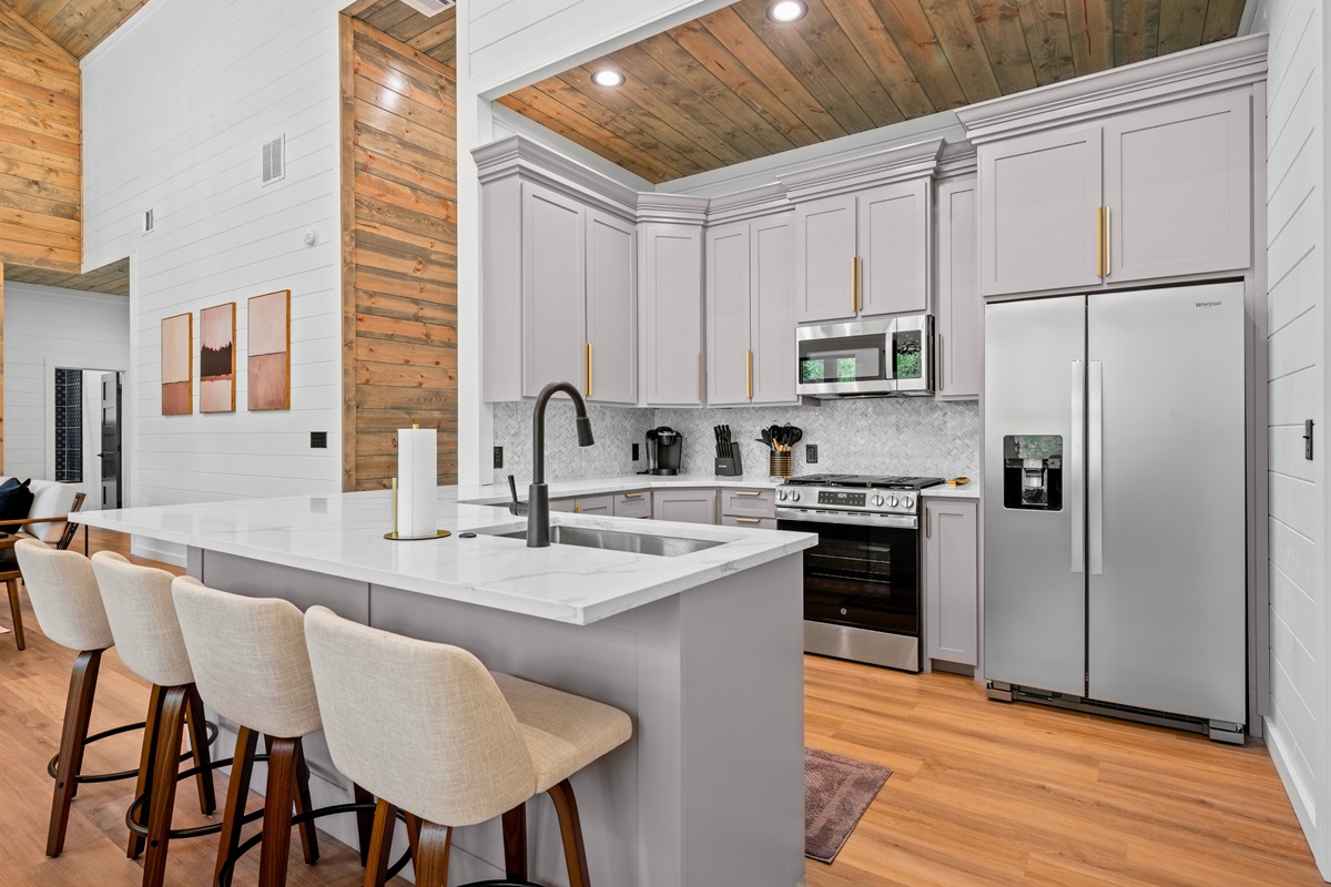 With its oversized island and open layout, the kitchen makes cooking for a group both easy and enjoyable.
