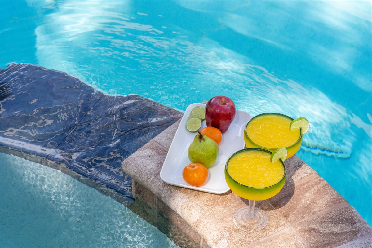 Poolside luxury meets family fun with this expansive spa and pool setup.