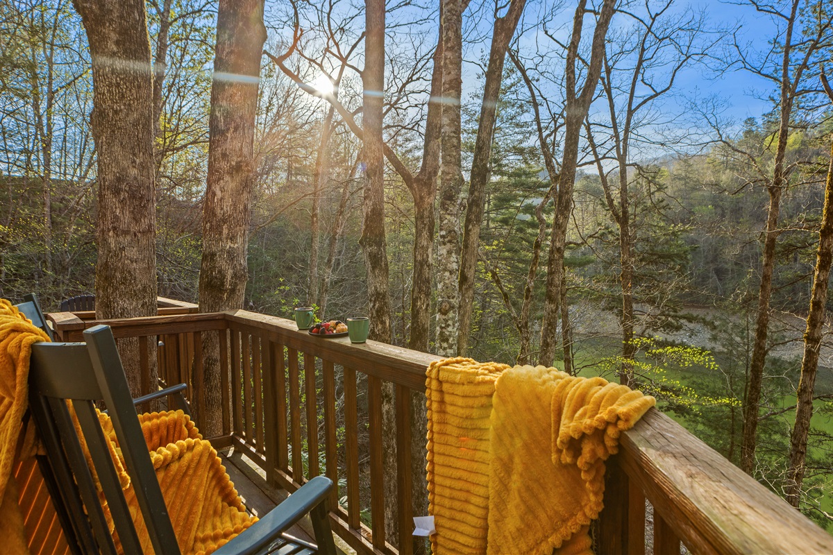 Deck: Sip morning coffee amidst nature's grandeur with stunning views and tranquility!