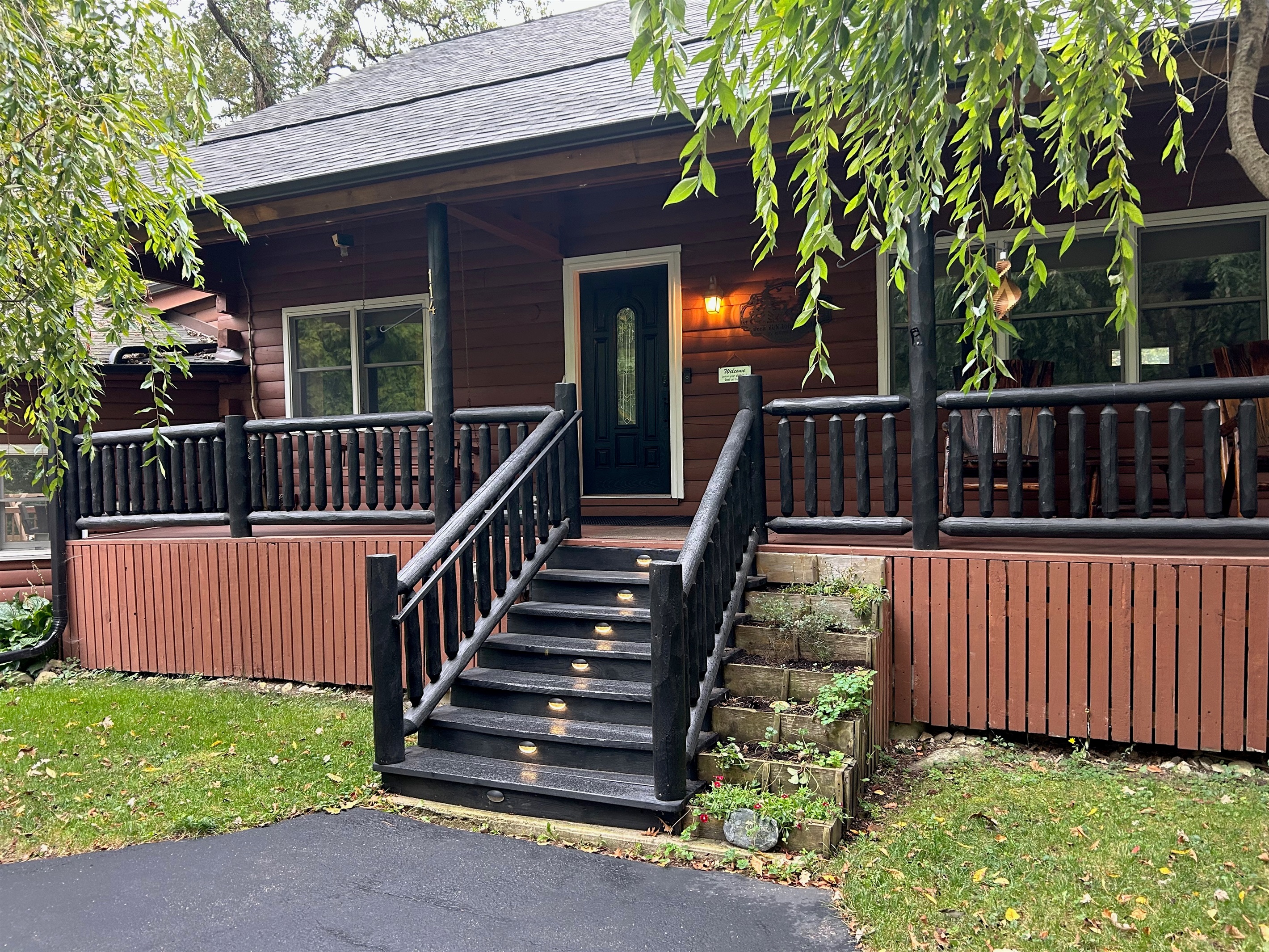 Stairs leading to the Log Cabin are lit at night.
