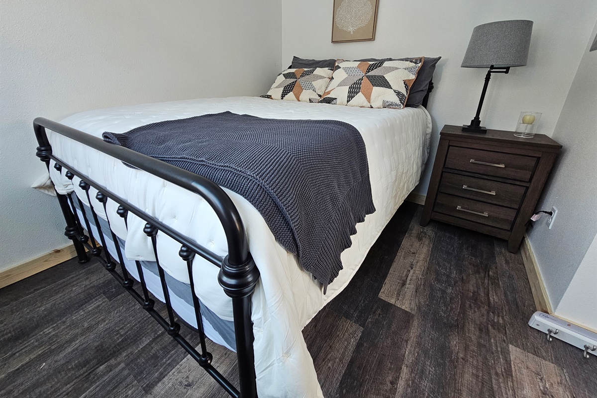 Bedroom on main floor includes a Queen Size Bed (cabin is still being furnished so furniture may vary by cabin).