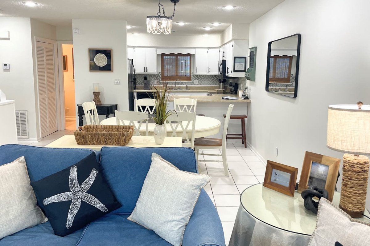 Move through the main level in one open sweep &mdash; kitchen, dining, and living connected with Gulf light all the way through.