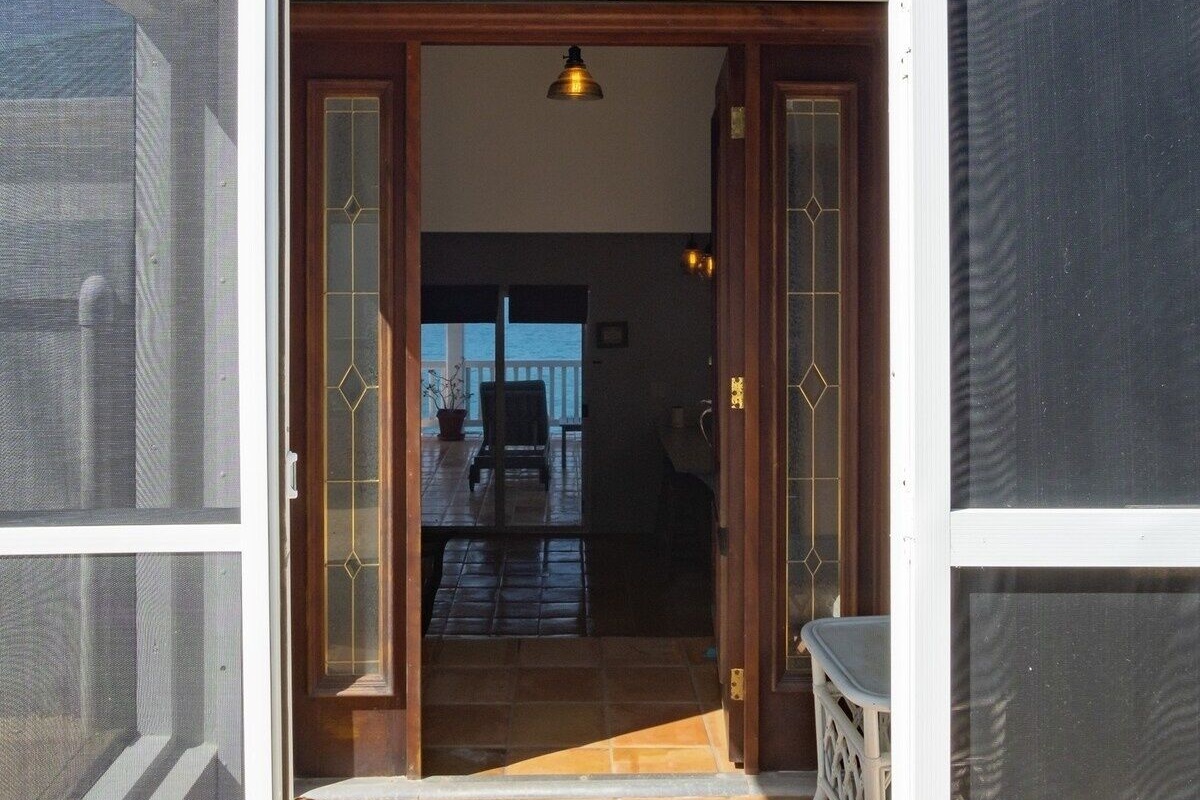 The front entrance of the property with a veiw straight to the back deck.