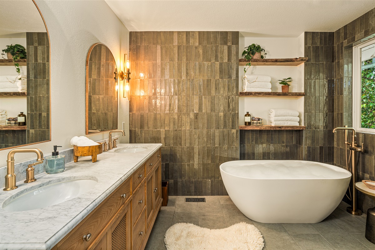 Spa bath: Indulge in a restorative bubble bath in this spa inspired bathroom: rain shower head and heated floors. Upscale toiletries, plush towels.