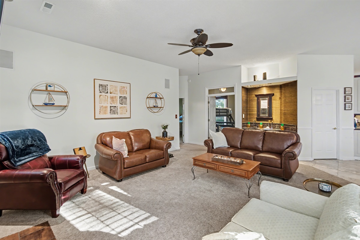 Living Room with wet bar, fire place and large TV